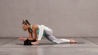 Abi Carver demonstrating Modified Lizard Pose